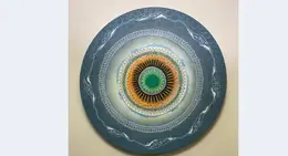 a circular art piece on a wall