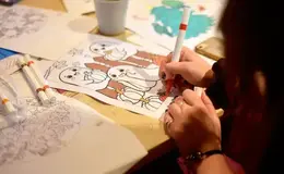 a person coloring a picture