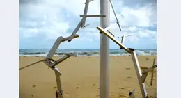 a group of metal objects on a beach