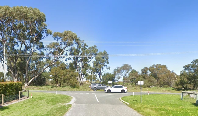 a road with cars parked in the middle of the road