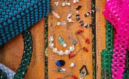 a group of jewelry on a bench