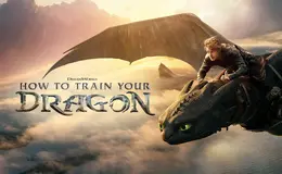 A young rider flying on a dragon above clouds and the ocean at sunset