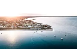 a body of water with boats and buildings