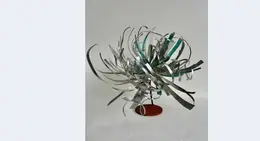a metal object with a white background