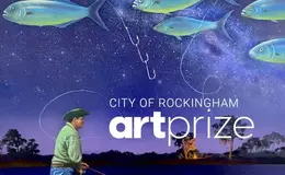 a man fishing in the night sky