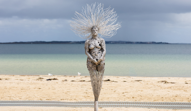 a statue on a beach