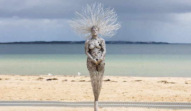 a statue on a beach