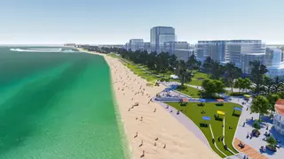 a beach with trees and buildings