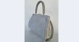 a white purse with a handle