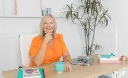 a woman sitting at a desk