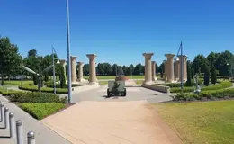 a large stone structure with a cannon in the middle
