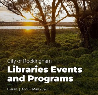 Sunset behind a lake with greenery and trees surrounding the lake.