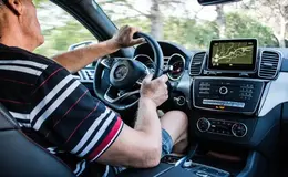 a man driving a car