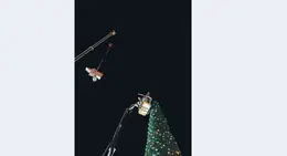 a group of people from a crane