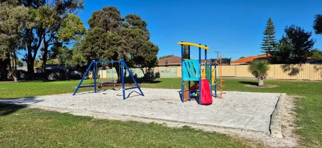 a playground with a swing set