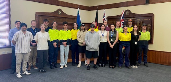 Group photo of our combined current YEP Cohort Trainees. Some are in high vis and others are in business casual attire.