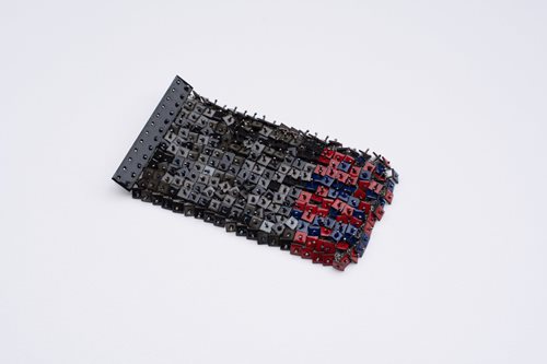 Melissa Cameron artwork of black, red and blue small buttons