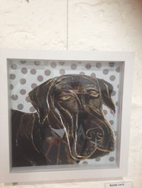 Lino print of artwork of a dog.