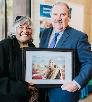 Theresa Walley and Mayor Sammels with portrait Theresa Walley and Mayor Sammels with portrait