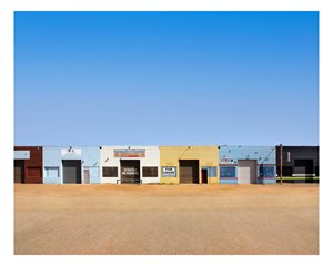 Row of commercial premises in a variety of colours.
