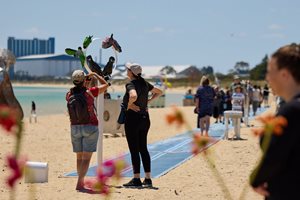 Person taking photo of Castaways sculpture at Rockingham Foreshore